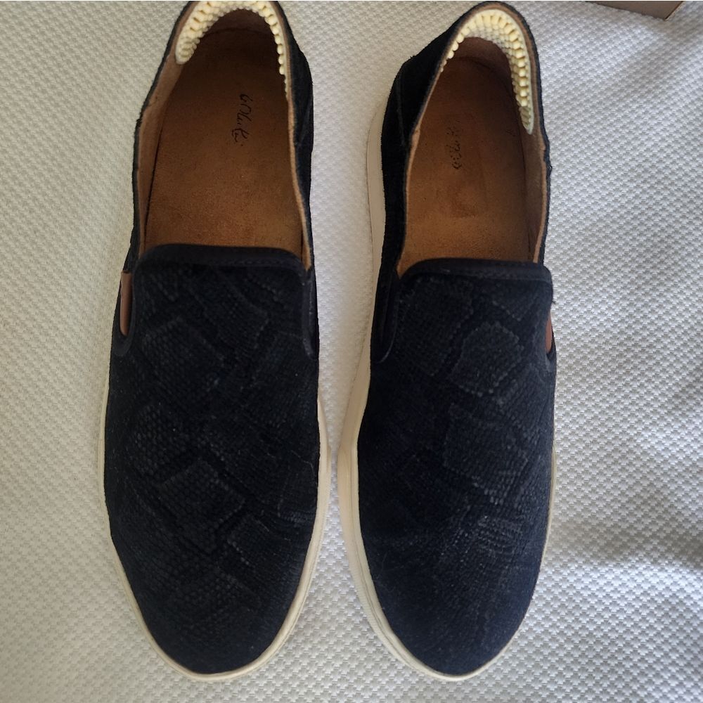OluKai Black and White Flats Sleek Slip-On Design